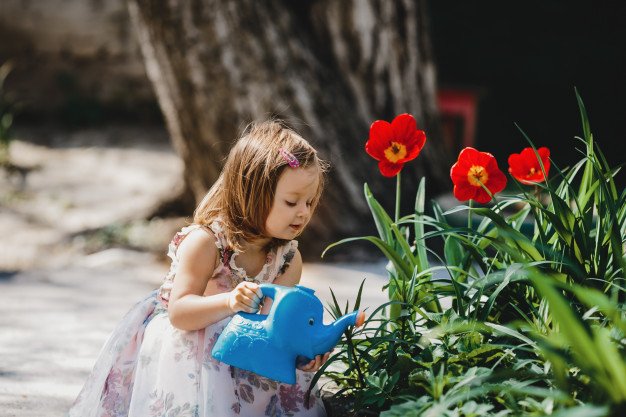 Charming Little Girl Takes Care About Flowers Garden 8353 7857