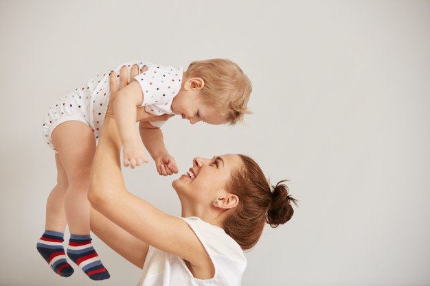 Young Mother Playing With Her Little Baby Bed 273609 13611